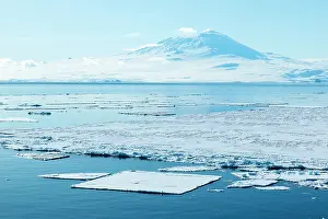 Cold Prints: Sea ice on McMurdo Sound with Mount Terror in background