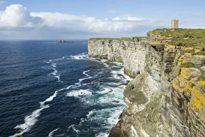 Seabird cliffs, Marwick Head RSPB and Kitchener Memorial tower, Orkney, Scotland, UK