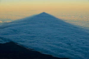 Shadows Collection: Shadow of the Teide volcano in sea of clouds at sunset, Teide National Park, Tenerife