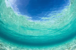 Shallow, turquiose water and the surface, with blue sky. Raja Ampat, West Papua, Indonesia