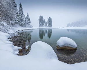 Guy Edwardes Gallery: Shore of Lago de Predil covered in snow, Italy, February 2018