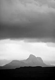 Silhouette of Stac Pollaidh against storm sky, viewed from Tanera More, Coigach and Assynt