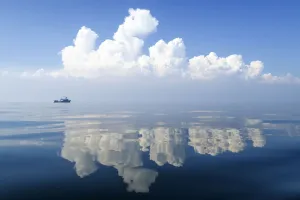 Thailand Prints: Small boat on calm waters with reflections of cloud formations, Gulf of Thailand, Pacific