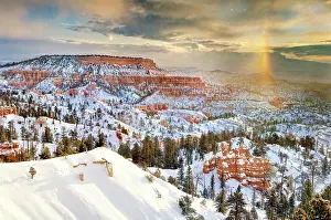 Dramatic Prints: A snow bow forming over the snow-covered red sandstone hoodoos