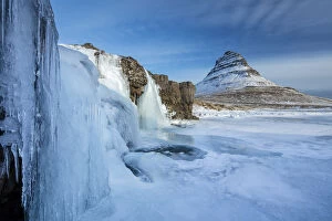 Waterfalls Gallery: Snow covered Kirkjufell Mountain and frozen waterfalls, , Snaefellsness Peninsula