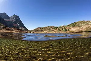 France Prints: Split level view of Noir Lake at the foot of the Taillefer mountains