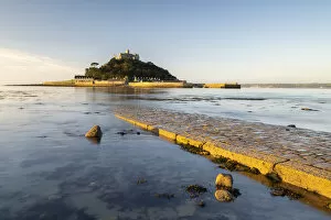St Michael's Mount in morning light, cobbled causeway underwater at high tide