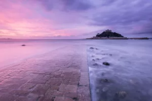 Pink Gallery: St Michaels Mount and old causeway at sunrise, Marazion, Cornwall, UK. October 2015