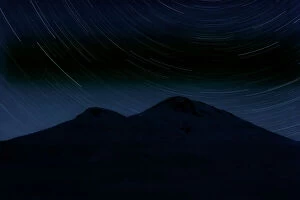 Star trails over Mount Elbrus (5, 642m) at night, Caucasus, Russia, June 2008