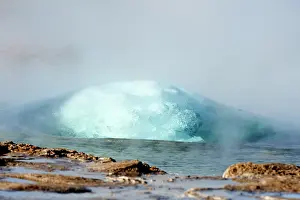 Steam Prints: Strokkur Geyser erupting. Air bubbles bloat the expanding top of the Geyser just before it erupts
