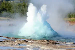 Steam Prints: Strokkur Geyser erupting. Air bubbles bloat the expanding top of the Geyser just before it erupts