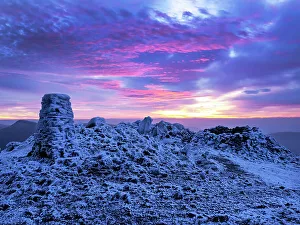 The summit of Red Screes covered by hoar frost at dawn Lake District UK, looking towards the Kentmere hills