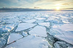 Cold Prints: Sunrise over sea ice, Franklin Island, Ross Sea, Antarctica. February, 2023