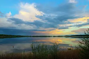 Twilight Prints: Sunset and a cloudy sky over Rederang lake