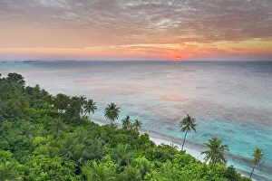 Maldive Islands Prints: Sunset over the ocean from Dhigurah Island