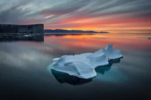 Sunset off Scott Island, with floating pieces of sea ice, Scott Inlet, Baffin Island, Canadian Arctic, August 2015