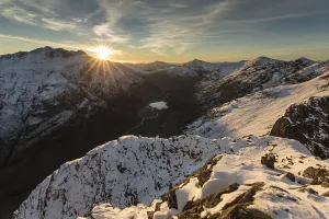 Summit Prints: Sunset over snow covered mountains