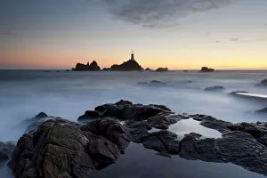 Sunset views of La Corbiere lighthouse located at the extreme south-western point of