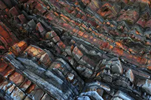 Sandstone Prints: Tilted sandstone, mudstone and siltstone rock strata contorted by tectonic plate movement during Hercynian orogeny