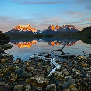 Towers and Central Massif reflected in Lago Pehoe at sunrise. Torres del Paine National Park