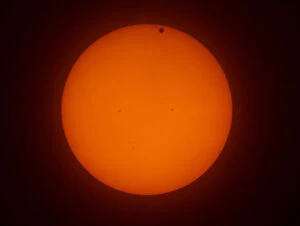 Orange Collection: The transit of Venus across the face of the sun, with visible sunspots, as seen from Aurora