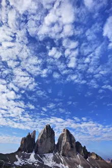 Tre Cime di Lavaredo mountains with clouds in the sky, Sexten Dolomites, South Tyrol