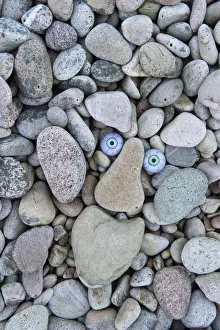 Pebbles Prints: Troll face amongst beach pebbles, Claggain Bay, Islay, Scotland