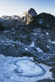 Images Dated 17th July 2009: Upper Kriz Lake with ice melting, Mount Triglav (2, 864m) in the distance, Triglav National Park