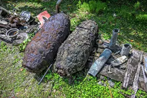 History Prints: Various remains of World War II related objects displayed in a community on Emirau Island