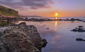 View of Ballycastle coastline at sunset, east of Ballycastle, County Antrim, Northern Ireland. July, 2021