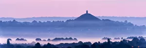 Images Dated 8th August 2013: View towards Glastonbury Tor with low lying mist at dawn from Waltons Hill, Glastonbury