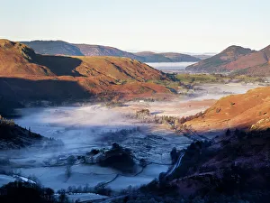 View from the Helvellyn range looking towards Skiddaw with valley mist from a temperature inversion, Lake District, Cumbria, UK. December, 2021
