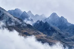 New Zealand Prints: View of jagged mountains shrouded in low cloud