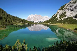 View over Lake Seebensee with Zugspitze and Wetterstein mountains in background, Alps, Tirol, Austria. September, 2020