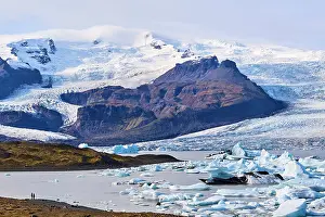 Iceberg Prints: View looking across icebergs on glacial lagoon with glacier in background