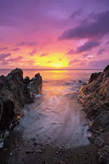 Devon Prints: View looking out to sea at sunrise from beach at Tor cross