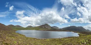 Exploring Britain Collection: View from Slieve Loughshannagh over Lough Shannagh to mountains of Slieve Meelbeg