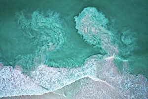 Blue Waters Collection: Waves crashing on beach and carrying sediments back out to sea, aerial view. The Bahamas