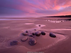 Devon Prints: Westward Ho! beach at sunrise, colourful sky at low tide and tidal pool, north Devon, UK