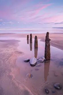 Devon Prints: Westward Ho! beach at sunrise, low tide with old wooden groynes exposed
